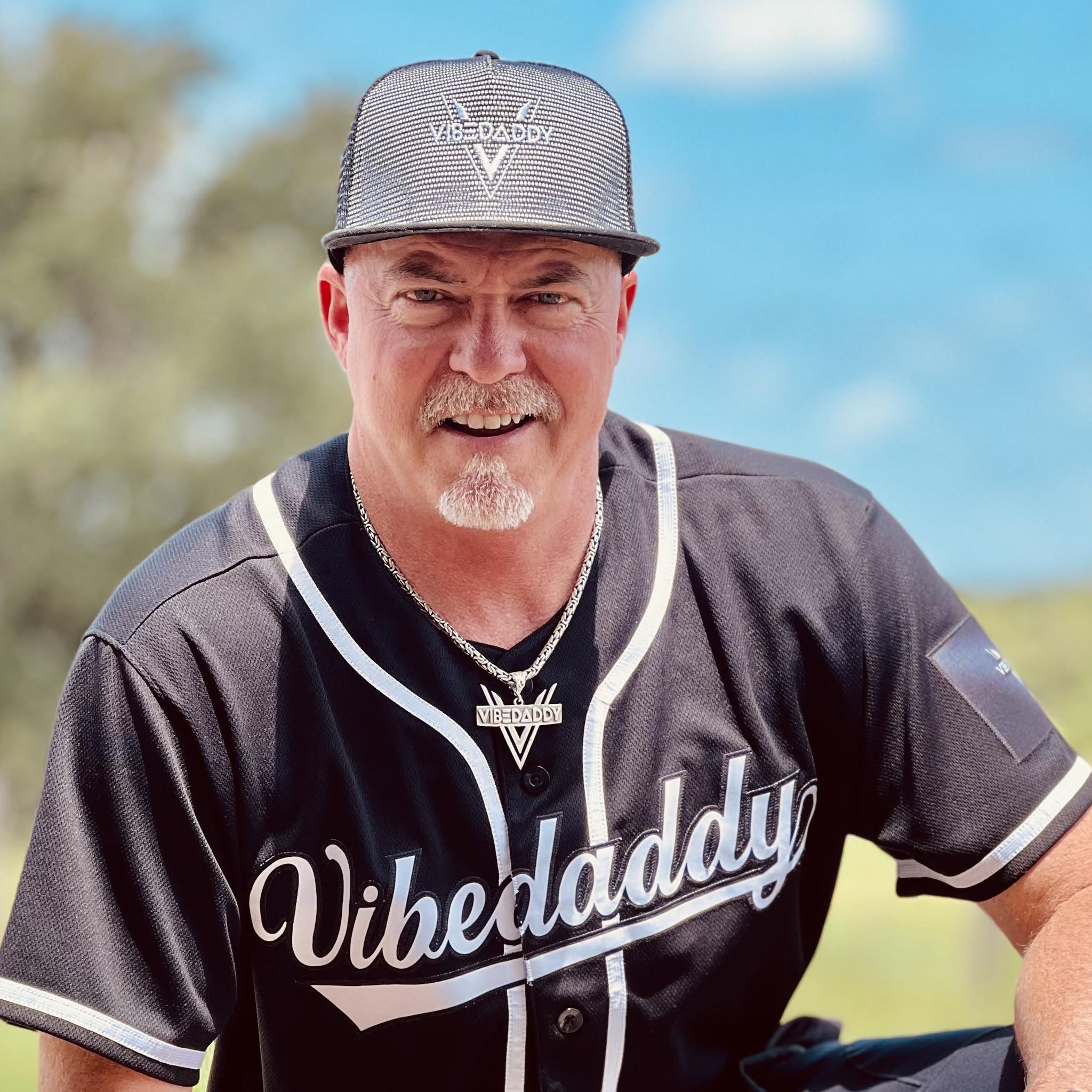 VibeDaddy wearing his signature VibeDaddy hat and jersey